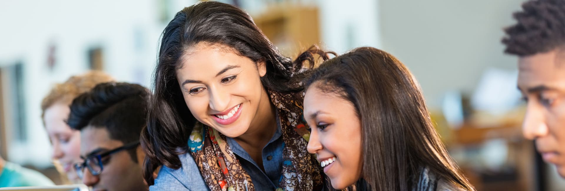 Adviser with students using the UCAS Hub