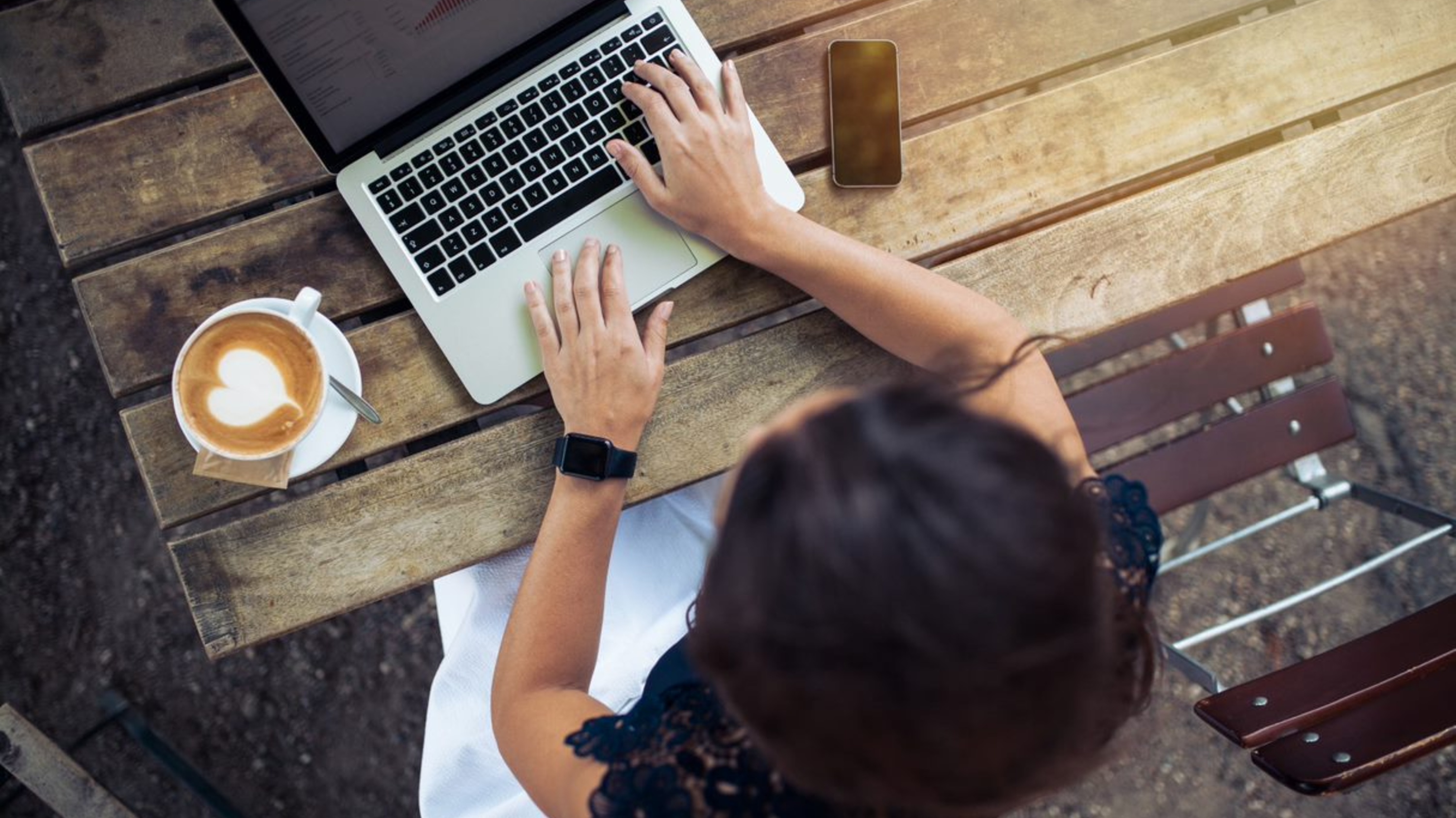 A woman works on a laptop