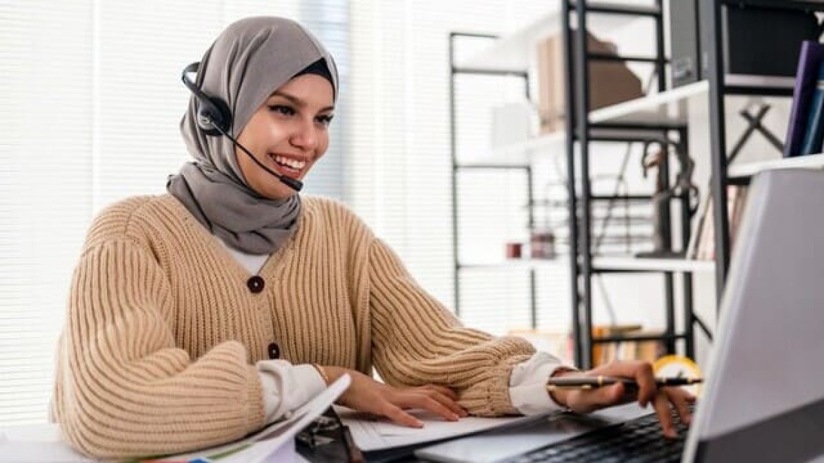 Woman at computer working remotely