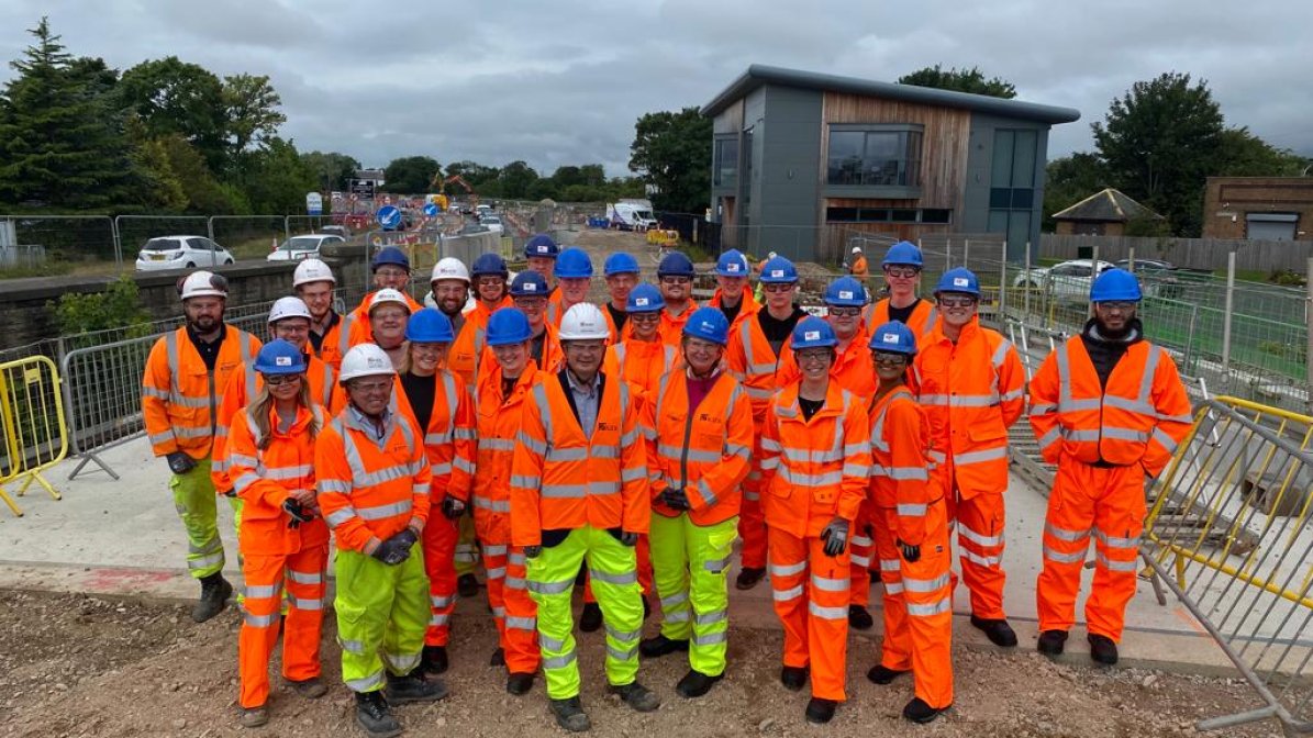 Engineering apprentices in hi-viz jackets on a construction site